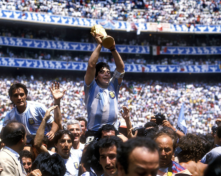 Historic action shot from the golden era of the men's football World Cup with Maradona, capturing a legendary squad during a defining tournament moment.