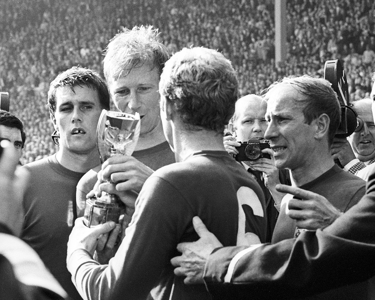 Archival picture of a men's football World Cup 1966 final trophy celebration, capturing the England national team lifting the championship cup.