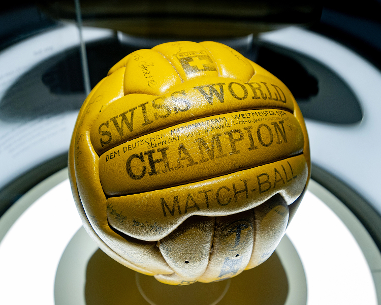 Detailed editorial product shot of a historic official match ball used in a past men's football World Cup tournament.