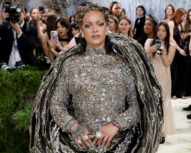 Rihana's iconic outfit on the Met Gala red carpet, representing premium celebrity fashion and arrival images.