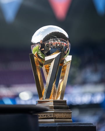 The Ligue 1 championship trophy under stadium lights.