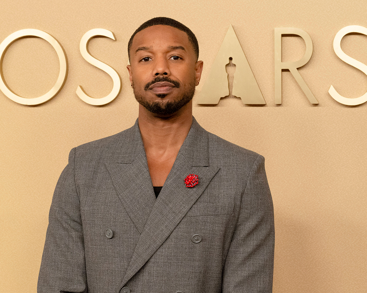 Michael B. Jordan poses on the Oscars red carpet, showcasing premium celebrity arrival photography.