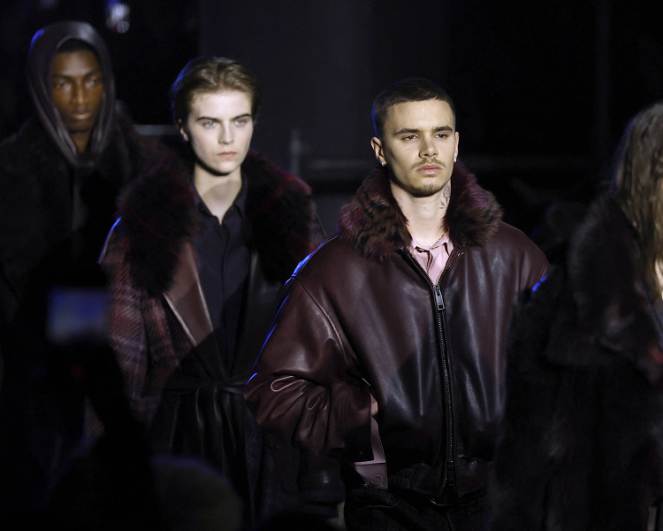 Romeo Beckham walks the Burberry runway during London Fashion Week.