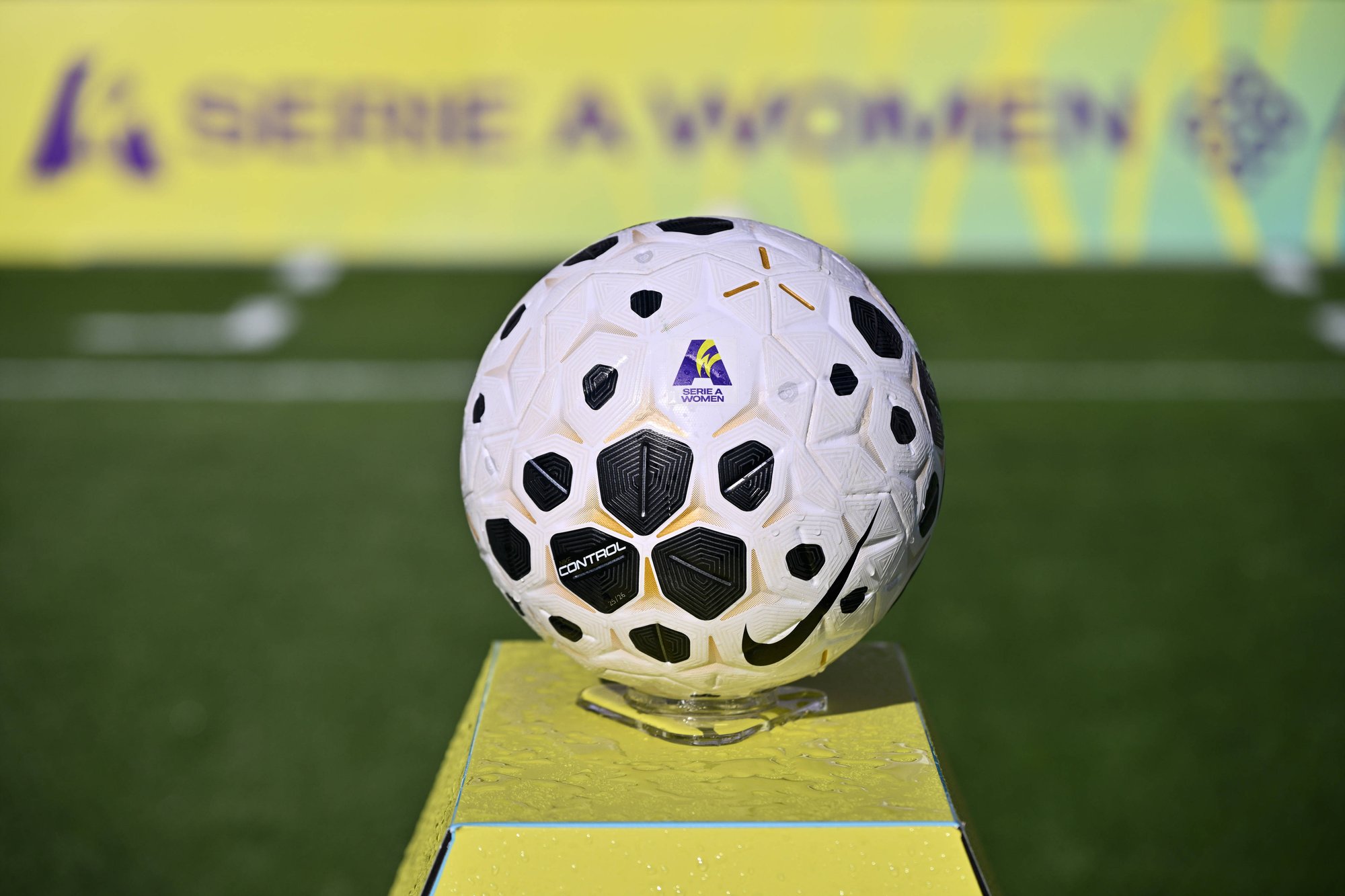 Official Serie A Women match ball displayed beside the pitch.