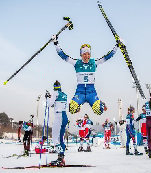 A skier celebrating the victory at the Winter Olympic Games, an example of a hand-picked shot from IMAGO's expert-curated image collections.